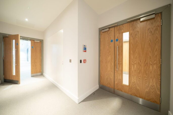 Commercial office timber doors_veneer finish_vision panel_integrated hardware and access control_fire door_Concealed riser doors