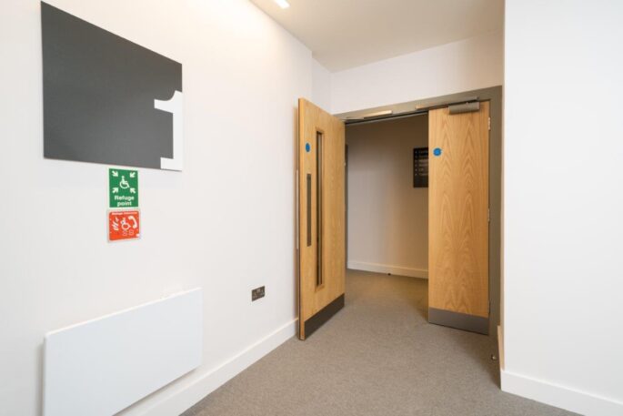 Corridor door_leaf and a half timber fire door with access control_hold open access_integrated hardware