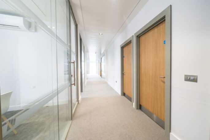 Oak effect solid timber fire doors_corridor timber doors_Commercial_office block_door frames