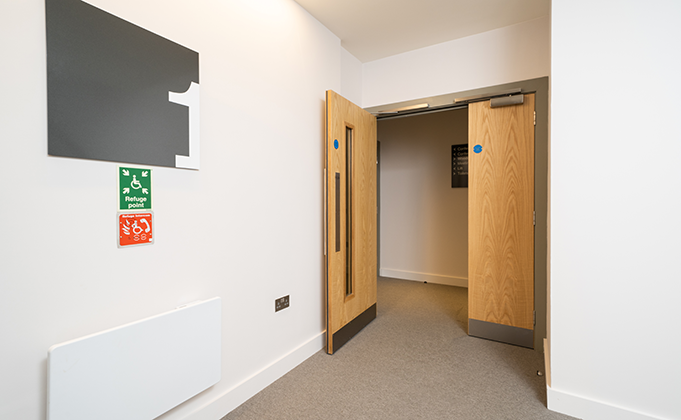 Corridor door_leaf and a half timber fire door with access control_hold open access_integrated hardware
