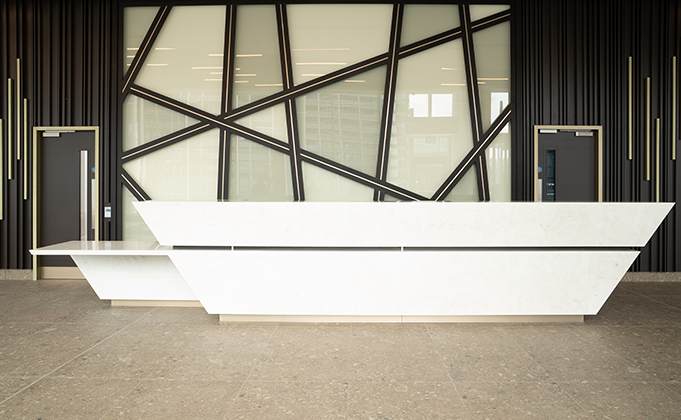 lobby area commercial office building timber doorset with vision panel and ironmongery