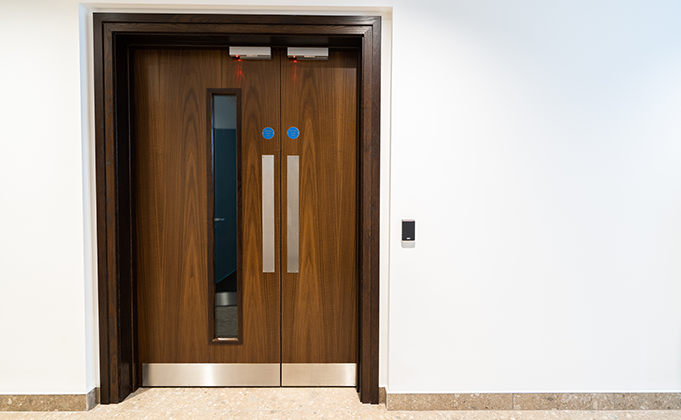 Timber corridor door with frame_walnut finish_full length vision panel_fire door_leaf and a half_access control_electric locking
