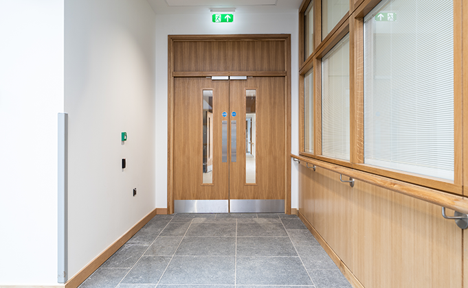 Timber fire door with magnetic locking_access control_corridor door_healthcare_Education_leisure_office_vision panels_solid overhead panel