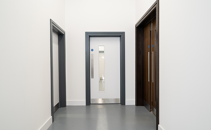 White timber fire doors_vision panel_paint grade timber doors_timber frames_corridor doors